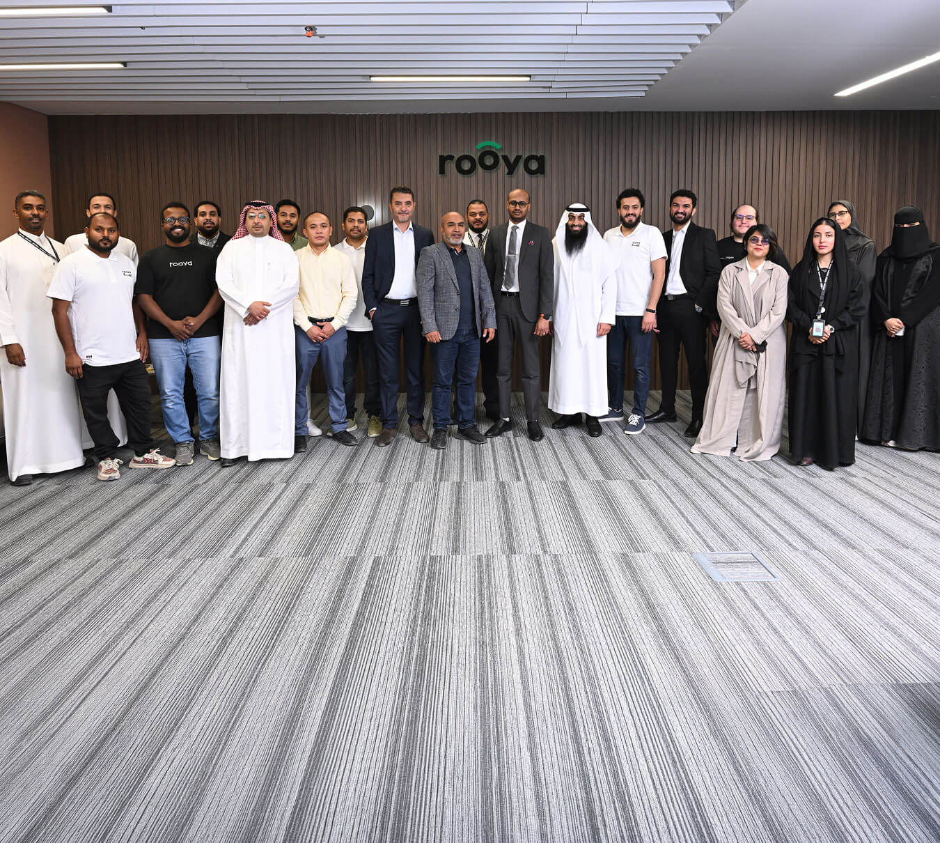 Rooya team collaborating in the office